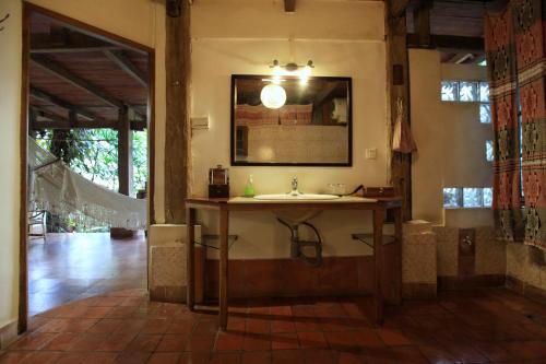 a bathroom with a sink in a room at You Ran Tai in Jinghong