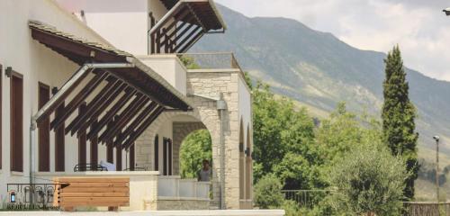 a house with a view of a mountain at KERCULLA Resort in Gjirokastër