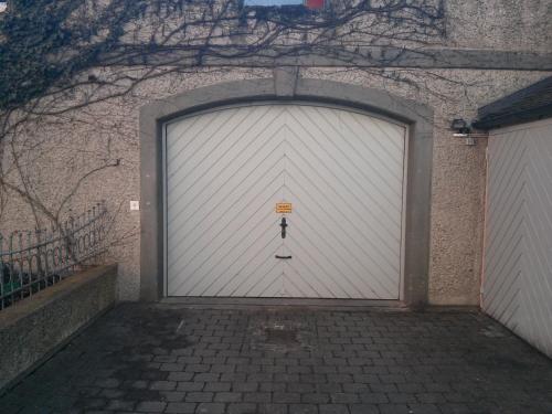 a large white garage door with a man on it at Hotel Alt-Ringlein in Bamberg