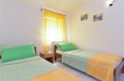 Postel nebo postele na pokoji v ubytování Apartments Veljko 100