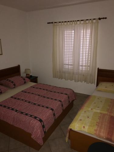 Postel nebo postele na pokoji v ubytování Apartments Juran Sukosan