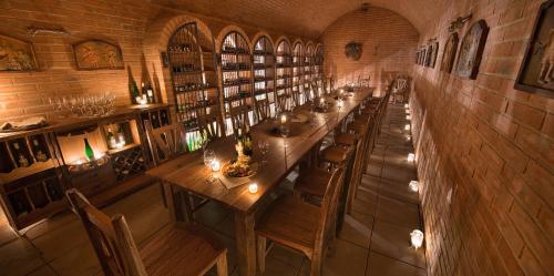 a long dining room with a long table and chairs at Wellness Hotel Happy Star in Hnanice