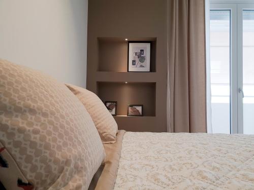 a bedroom with a bed and a window at Fiume Luxury Apartments near the SEA in Monopoli