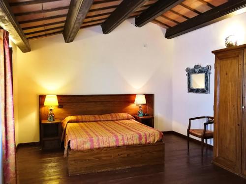 Un pat sau paturi într-o cameră la Hotel Il Vecchio Mulino