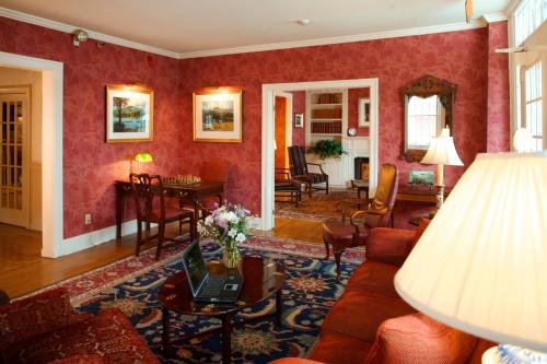 a living room with a couch and a table at Green Mountain Inn in Stowe