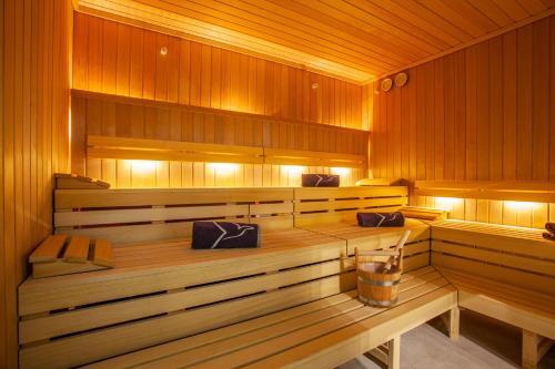 a sauna with wood paneling and a wooden at Grupotel Playa de Palma Suites & Spa in Playa de Palma