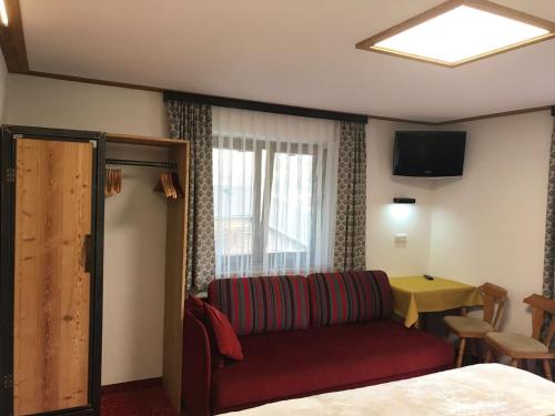 a living room with a couch and a table at Haus Katharina in Wagrain