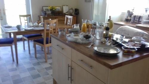 a kitchen counter with a bunch of dishes on it at Tigh A Raoin in Portree