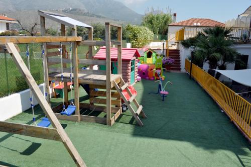a playground with a ladder and a play structure at Terra Mia in Formia