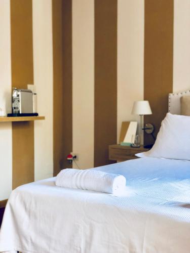 a hotel room with a bed with a towel on it at Palazzina300 in Treviso