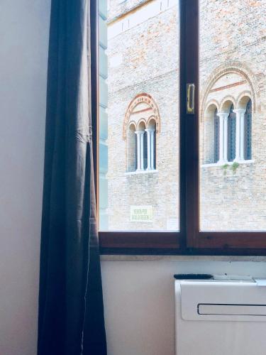 a window in a room with a building at Palazzina300 in Treviso