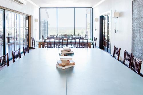 a large room with a table with books on it at Hillside Boutique Hotel in Castroville