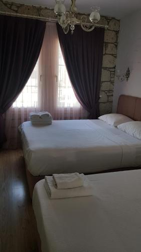 Lova arba lovos apgyvendinimo įstaigoje Alacati Alaris Hotel