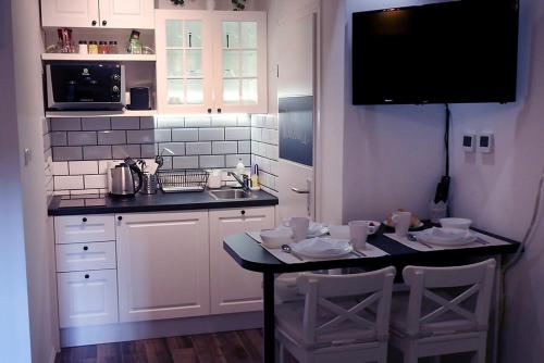 Kuchyňa alebo kuchynka v ubytovaní Mely Apartment in the City Center