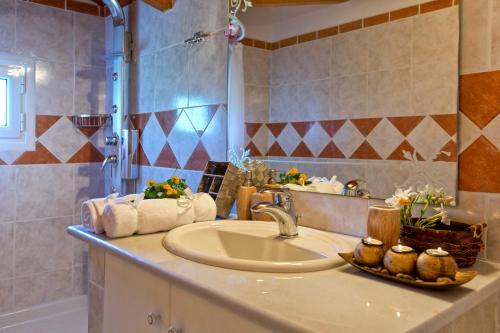 a bathroom with a sink and a shower at Achilles Country House in Corfu Town