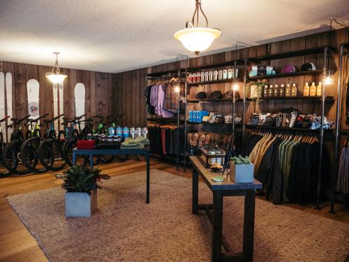 a bike shop with two tables and racks of bikes at LOGE Bend in Bend