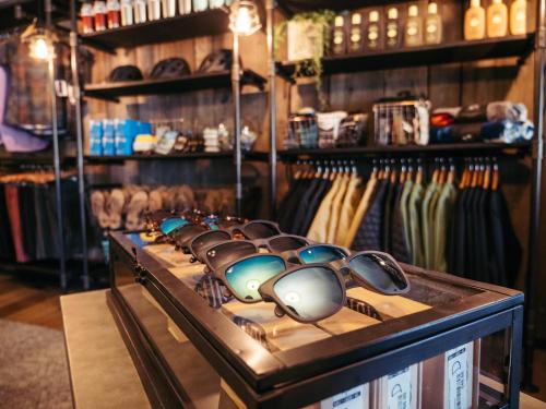 a row of sunglasses on display in a store at LOGE Bend in Bend