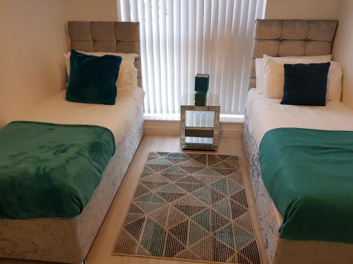 Un pat sau paturi într-o cameră la Vetrelax Blake Lodge