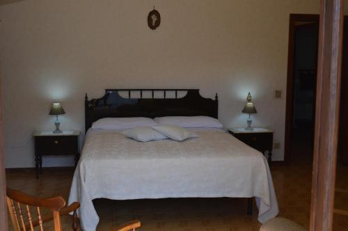 a bedroom with a bed with two pillows on it at La Piazzetta in Bolsena