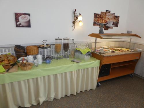 a table with a buffet of food on it at Gasthof zur Querenburg in Hannoversch Münden