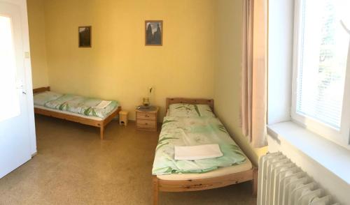 Ein Bett oder Betten in einem Zimmer der Unterkunft Apartmán Novákovi
