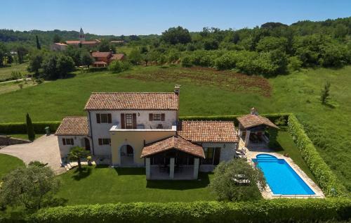 an aerial view of a house with a swimming pool at Villa Sujevic in Motovun