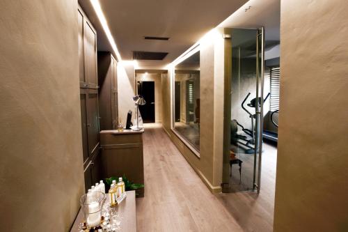 a bathroom with a mirror and a sink in a room at Hotel Dei Fiori Restaurant - Meeting & Spa in Alassio