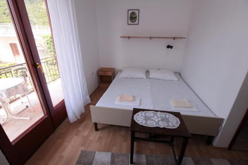 מיטה או מיטות בחדר ב-Apartments Adna