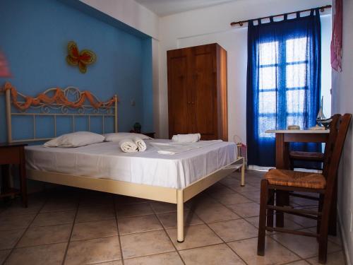 Ліжко або ліжка в номері Manos Apartments