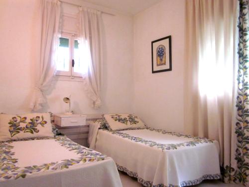 A bed or beds in a room at Casa Playa