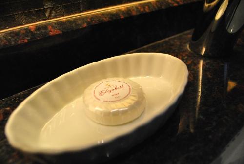 a white plate with a dessert on a table at Hotel Elizabeth Cebu in Cebu City