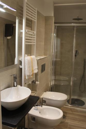 a bathroom with two sinks and a shower at Residence Fanny in Alassio