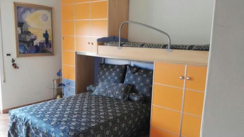 a bedroom with a bed and a bunk bed at Casa Testa in Formia