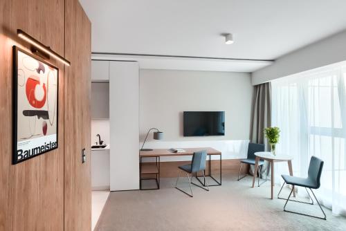 TV a/nebo společenská místnost v ubytování City Apartments - Marii Ludwiki 7