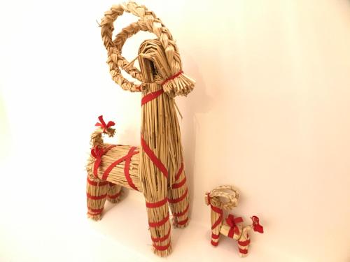 a wooden sculpture of an elephant with a red ribbon at SpoonDrift Hostal Kenting in Nanwan
