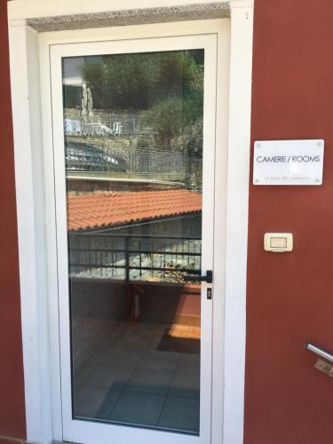a door with a sign that reads cancer records at Baia dei Gabbiani in San Lorenzo al Mare