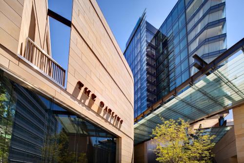 two views of a building with a glass facade at The Darling at The Star in Sydney