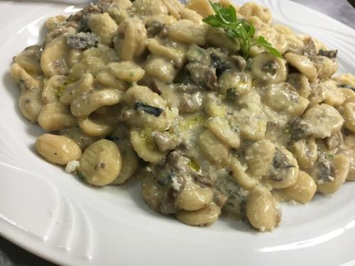 a plate of macaroni and cheese on a plate at Gorropu Hotel in Urzulei