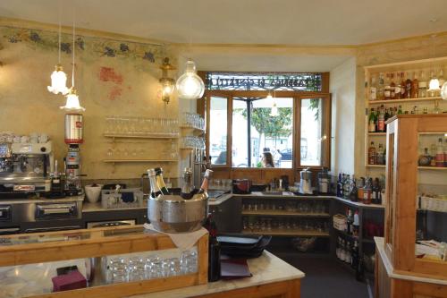 a large kitchen with a counter and a window at Torrione Trento in Trento