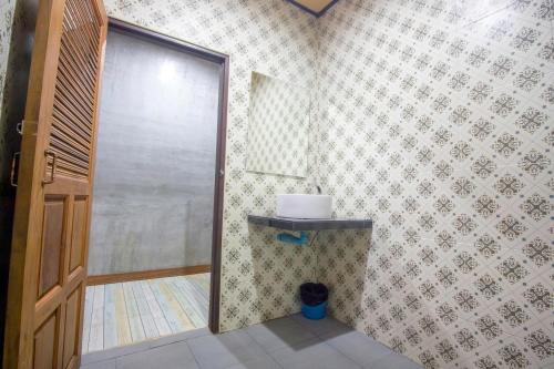 a bathroom with a shower with a glass door at Khao Sok Palmview Resort in Khao Sok