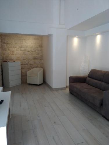 a living room with a couch and a table at Domus Rosae in Scicli