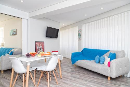 a living room with a couch and a table at BestVillas Âncora Mar in Vila Praia de Âncora