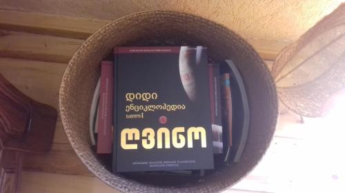a book holder filled with books on a wall at Cabernet Tali in Tʼelavi