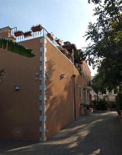 a fence on the side of a building at Villa Musica in Sannicola