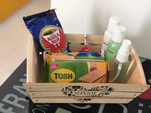 a crate filled with food and toiletries on a table at Edificio saintjoseph in Cali