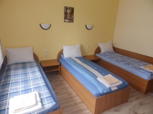 two twin beds in a room at Mix Hotel in Vidin