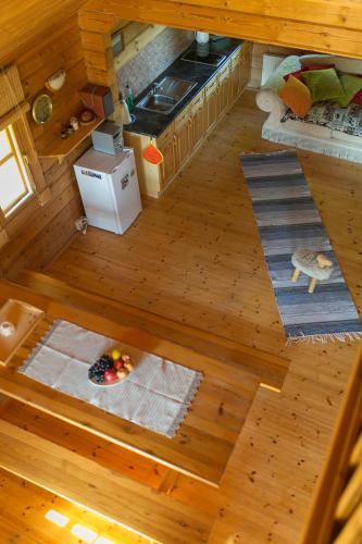 an overhead view of a living room with wood floors at Kangru Holiday Home in Vanamõisa