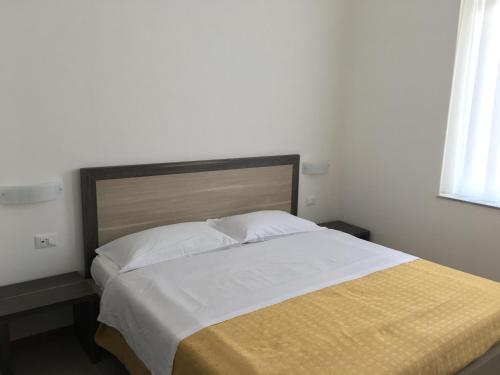 Una cama o camas en una habitación de Hotel Virgilio