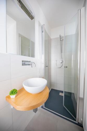 a bathroom with a sink and a shower at Pepito palace in Cefalù