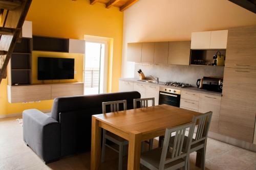 a living room with a table and a couch at Gate To Verona in Verona